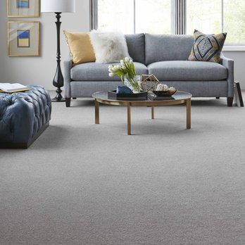 Floormax - a living room with a couch and a coffee table - Flooring Near Me - Elkridge, Maryland Floormax - a living room with a couch and a coffee table - Flooring Near Me - Elkridge, Maryland