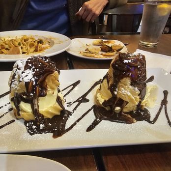 Mely's Cafe - Italian dessert. Light and delicious. It was like a cream puff with ice cream in the middle drizzled in chocolate syrup. - Italian Near Me - San Pablo, California
