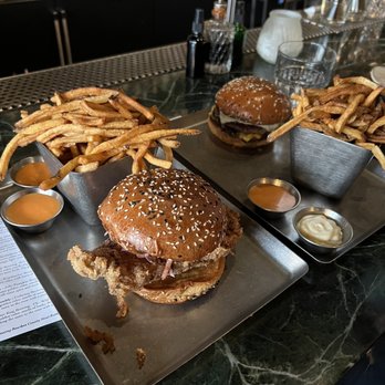 Gretel - Burger chicky sandwich with sauces on side.  Real good - Cocktail Bars Near Me - Chicago, Illinois