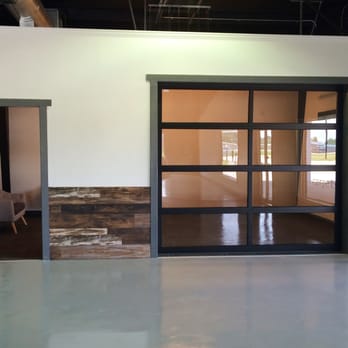 Plank & Tile - Full glass garage door inside that opens for conferences and special events. - Flooring Near Me - Statesboro, Georgia Plank & Tile - Full glass garage door inside that opens for conferences and special events. - Flooring Near Me - Statesboro, Georgia