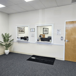 Palms Medical Group - Front check-in area at the Fleming Island primary care facility with two service windows.