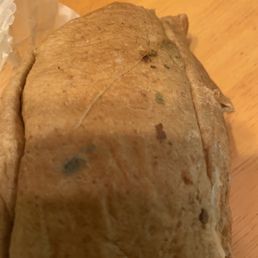 The steak sandwich with mold on the bread.