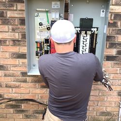 Mr. Electric of Gulfport - Making the final connection on outside panel