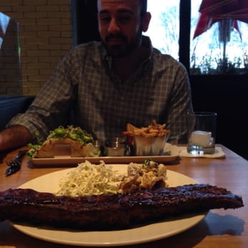 Earls Kitchen + Bar - Full rack of ribs and chicken tacos in the back - New American Near Me - Somerville, Massachusetts