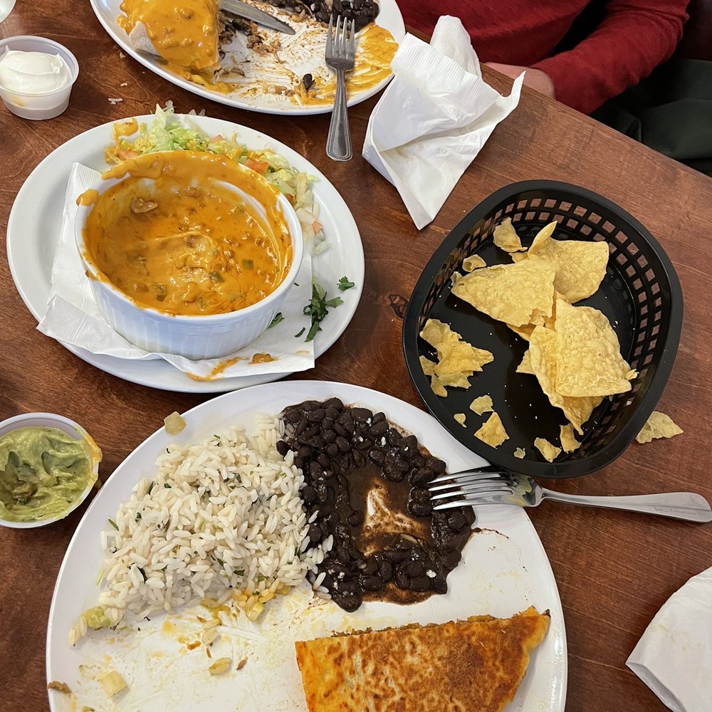 Sadie Romo’s - Chicken burrito covered in chorizo queso, app of chorizo queso and chips, and pulled pork stuffed quesadilla! Delish! - Food Trucks Near Me