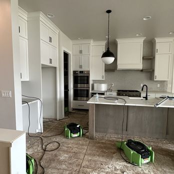 Core Building Co. - All flooring and baseboards demolished to dry out subfloor, cabinet toe kicks removed. - General Contractors Near Me - Eagle, Idaho