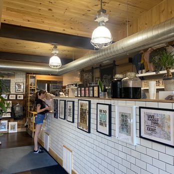 Crosshatch coffee - a woman standing in a coffee shop - Bakeries Near Me - Siren, Wisconsin