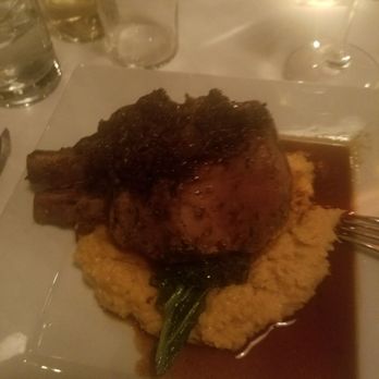 Theo's Rogers - Double chop on top of cheese grits and bourbon glaze. Amazingly tender from sous vide. - New American Near Me - Rogers, Arkansas Theo's Rogers - Double chop on top of cheese grits and bourbon glaze. Amazingly tender from sous vide. - New American Near Me - Rogers, Arkansas