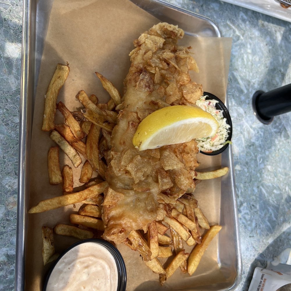 The Bruce Bar & Grill - Salt + Vinegar Fish N Chips (A generous haddock fillet dipped in house beer batter then coated with crispy salt and vinegar chips) - Steakhouses Near Me - Kincardine, Ontario The Bruce Bar & Grill - Salt + Vinegar Fish N Chips (A generous haddock fillet dipped in house beer batter then coated with crispy salt and vinegar chips) - Steakhouses Near Me - Kincardine, Ontario