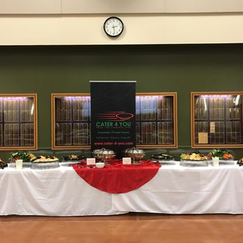 Cater 4 You - a buffet table with a clock - Caterers Near Me - Renton, Washington Cater 4 You - a buffet table with a clock - Caterers Near Me - Renton, Washington