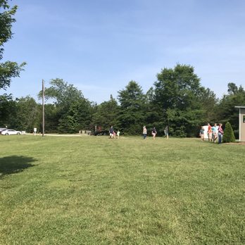 All A Flutter - View of parking in the distance on left and the admissions building on right and the gravel drive. - Pet Breeders Near Me - High Point, North Carolina