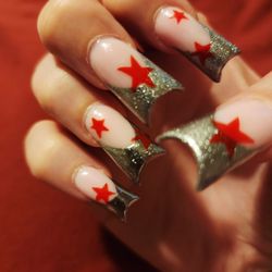 Neon Nails and Spa - Chrome silver with red stars, duck nails.
