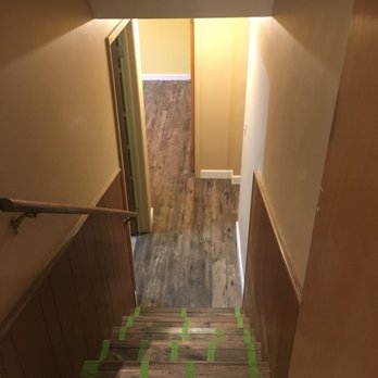 Custom Flooring Specialists - Basement after! The stairs are taped to allow them to stabilize. - Flooring Near Me - Arvada, Colorado