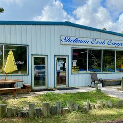 Shellman Crab Company - Storefront. Note, behind the yellow umbrella is the name Fish Tails restaurant.
