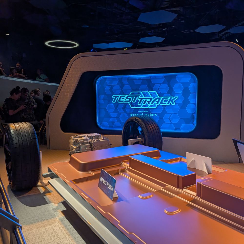 Test Track - Car battery pack model in line at Test Track at World Discovery at EPCOT at Walt Disney World Resort. - Amusement Parks Near Me - Bay Lake, Florida Test Track - Car battery pack model in line at Test Track at World Discovery at EPCOT at Walt Disney World Resort. - Amusement Parks Near Me - Bay Lake, Florida