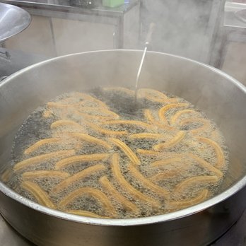 J. Argiles - Churros in a vat of oil - Desserts Near Me - Barcelona, B J. Argiles - Churros in a vat of oil - Desserts Near Me - Barcelona, B