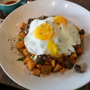 Bistro Cafe - Papa Griegas de Churrasco (Greek Fries with Skirt Steak) with 2 sunny side up eggs - Breakfast & Brunch Near Me - Miami, Florida Bistro Cafe - Papa Griegas de Churrasco (Greek Fries with Skirt Steak) with 2 sunny side up eggs - Breakfast & Brunch Near Me - Miami, Florida