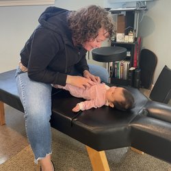 Core Chiropractic - Emmy's first adjustment 4 weeks old