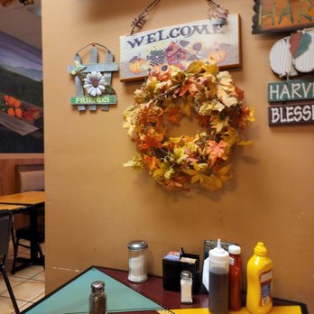 Harvest Cafe - a wreath of leaves hanging on the wall - American Near Me - Davie, Florida
