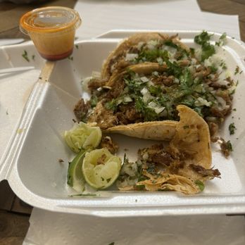 Fiery Kitchen Taco - Carnitas tacos... that is the amount of hot sauce that they gave with the taco. Normally that's fine but the meat was beyond dry. - Tacos Near Me - Jacksonville, Florida