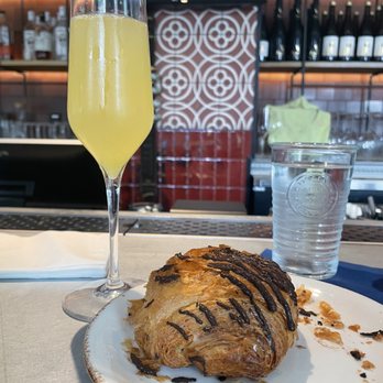 Junction Bistro Bar and Bakery - Mimosa glass + Chocolate Croissant - Bakeries Near Me - Washington, DC, District of Columbia Junction Bistro Bar and Bakery - Mimosa glass + Chocolate Croissant - Bakeries Near Me - Washington, DC, District of Columbia