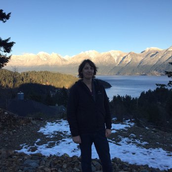 Oriental Palace Restaurant - a man standing in front of a lake - Chinese Near Me - Calgary, Alberta