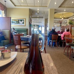 A bottle of warm pancake syrup