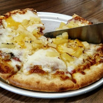 Flying Pie Pizzaria - Tried to take a picture of the whole pie but some people just can't wait - Pizza Near Me - Boise, Idaho Flying Pie Pizzaria - Tried to take a picture of the whole pie but some people just can't wait - Pizza Near Me - Boise, Idaho