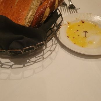 The Palm - Orlando - Bread Service w/ olive oil, chili flakes, and parmesean cheese - Steakhouses Near Me - Orlando, Florida The Palm - Orlando - Bread Service w/ olive oil, chili flakes, and parmesean cheese - Steakhouses Near Me - Orlando, Florida