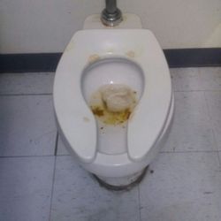 Big Lots - The disgusting Women's Restroom and Dirty Floors that need repairs. Why would you keep the broom and dust pan in the restroom...
