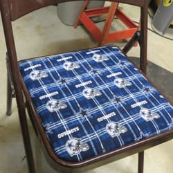 Chair had a rip in the seat. Recovered with material that shows one of Tim's fav teams.