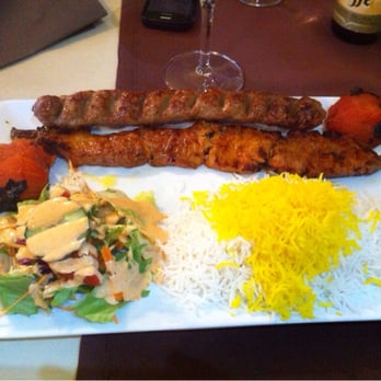 Tagh Bostan - Heerlijk lamsvlees met rijst met saffraan en gegrilde tomaten. - Middle Eastern Near Me - Brussels, BRU