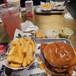 Spicy chicken sandwich, fries, coleslaw slaw and pickles with a blueberry lavender lemonade. Spicy chicken sandwich, fries, coleslaw slaw and pickles with a blueberry lavender lemonade.