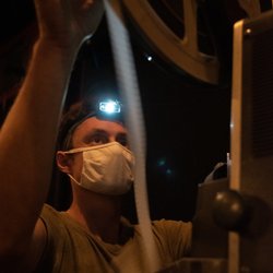 Ragtag Cinema - Ragtag Cinema Tech Director Travis Bird prepares 16mm film for a special experimental film screening