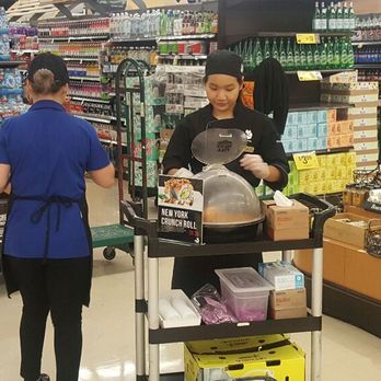 JFE Sushi Bar - a man and a woman in a grocery store - Sushi Bars Near Me - Avon, Colorado
