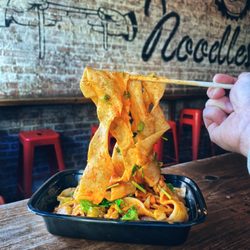 The Handpulled Noodle - Ribbon noodles stir fried in our signature traditional style.