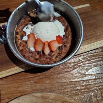 TownHall - The cookie that comes out sizzling in their pan topped with fresh strawberries and ice cream. - New American Near Me - Columbus, Ohio