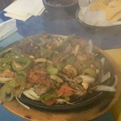 Toro Mexican Grill - Burrito Jalisco..see any of the large chunks of meat and shrimp that are shown on the menu picture. Because there isn't any.