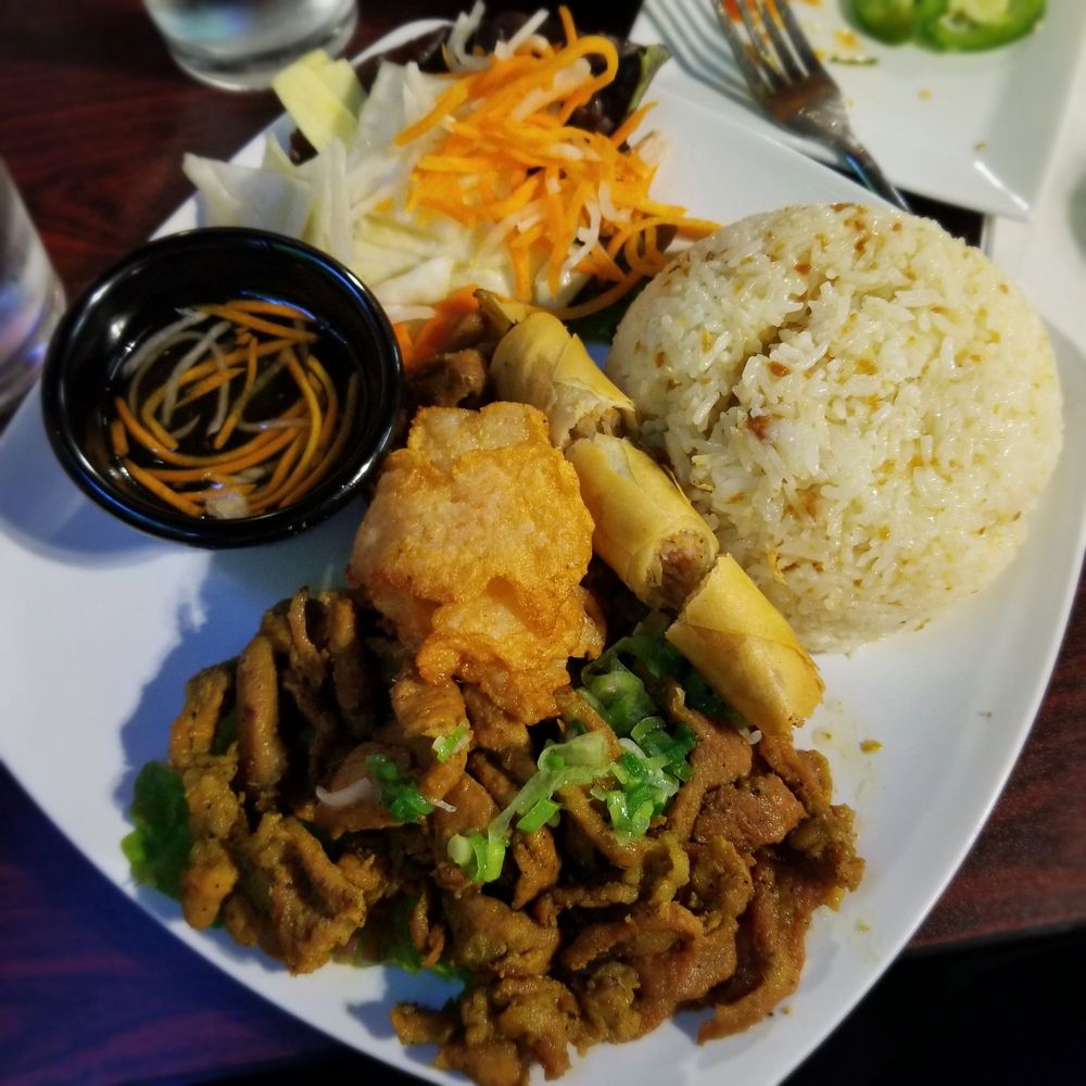 IPho - Com Dac Biet - Grilled pork, egg roll, shrimp cake, and jasmine garlic butter rice with pickled veggies and fish sauce - Vietnamese Near Me - New Paltz, New York IPho - Com Dac Biet - Grilled pork, egg roll, shrimp cake, and jasmine garlic butter rice with pickled veggies and fish sauce - Vietnamese Near Me - New Paltz, New York