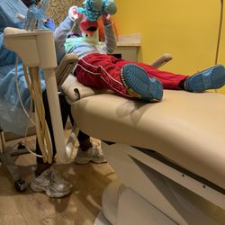 Polkadot Pediatric Dentistry - Gave him an Elmo to help calm his nerves.