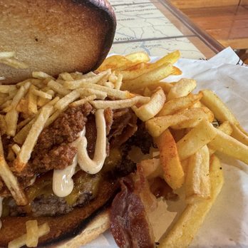 Carnival Magic Guy’s Burger Joint - Pig Patty with chili... side of fries - Burgers Near Me