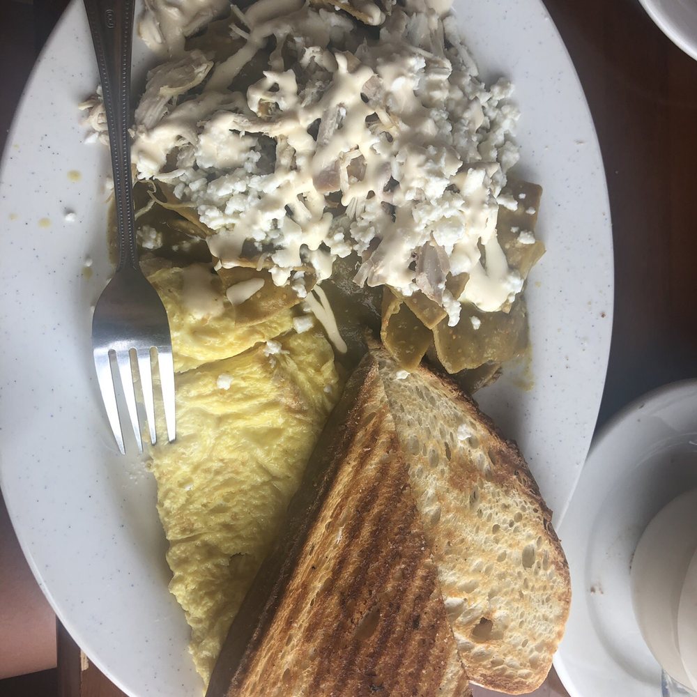Chilaquiles verdes with shredded chicken and scrambled eggs Chilaquiles verdes with shredded chicken and scrambled eggs