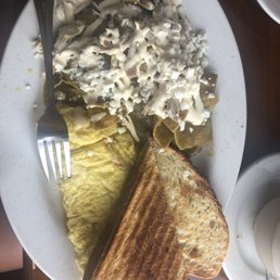Chilaquiles verdes with shredded chicken and scrambled eggs Chilaquiles verdes with shredded chicken and scrambled eggs