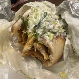 Half eaten chicken gyro wrap. It's huge! Half eaten chicken gyro wrap. It's huge!