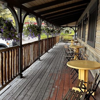 The Virginian Restaurant - a porch with tables and chairs - American Near Me - Jackson, Wyoming