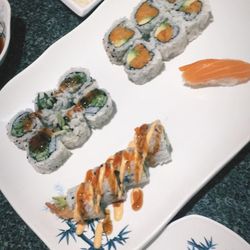 Sushi Eleven - Yam tempura in the top right, I believe the others are cucumber roll and dynamite