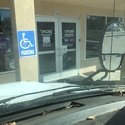 Anytime Fitness - Low sign near handle "we are unstaffed" sorry