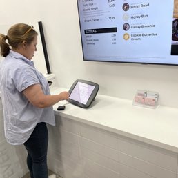 a woman using a tablet computer a woman using a tablet computer