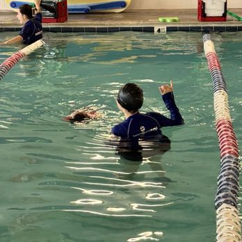 Aqua-Tots Swim School Orange - Coach Bernice teaching backstroke - Swimming Lessons/Schools Near Me - Orange, California Aqua-Tots Swim School Orange - Coach Bernice teaching backstroke - Swimming Lessons/Schools Near Me - Orange, California