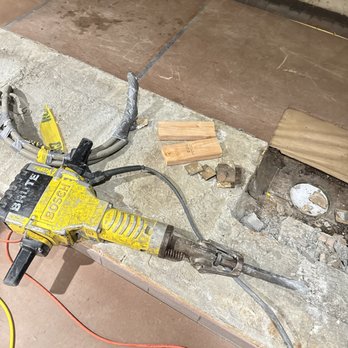 Easy Home Pipe Service - breaking the concrete to install new commercial floor sink drain - Plumbing Near Me